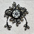 Pulsera con la flor blanca y negra
